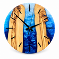 Blue Canyon Olive Wood & Resin Wall Clock in blue and white on a white background