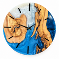 Blue Cross Section Olive Wood & Resin Wall Clock in blue and white on a white background