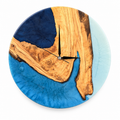 Blue Geometry Olive Wood & Resin Wall Clock in blue, navy and white on a white background