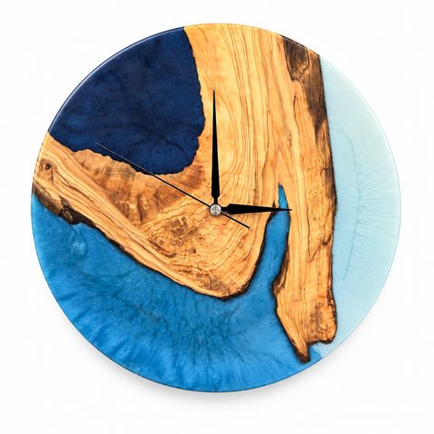 Blue Geometry Olive Wood & Resin Wall Clock in blue, navy and white on a white background