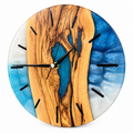 Blue Hollow Olive Wood & Resin Wall Clock in blue and white on a white background