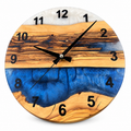 Blue Ridgeline Olive Wood & Resin Wall Clock in blue and pearly white on a white background