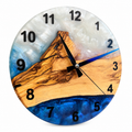 Blue Summit Olive Wood & Resin Wall Clock in blue and pearly white on a white background