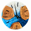 Blue Wood Circles Olive Wood & Resin Wall Clock in blue and white on a white background