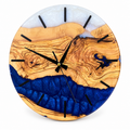 Cobalt Coast Olive Wood & Resin Wall Clock in deep blue and pearly white on a white background