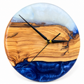 Deep Blue Horizon Olive Wood & Resin Wall Clock in deep blue and white on a white background