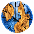 Frozen River Olive Wood & Resin Wall Clock in blue and pearly white on a white background