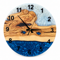 Ocean Drift Olive Wood & Resin Wall Clock in blue and white on a white background