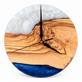 Pearl Bluff Olive Wood & Resin Wall Clock — front view on white