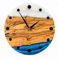 Pearl Horizon Olive Wood & Resin Wall Clock in blue and pearly white on a white background