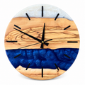 Sapphire Bands Olive Wood & Resin Wall Clock in blue and white on a white background