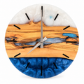 Silver Inlet Olive Wood & Resin Wall Clock in blue and pearly white on a white background