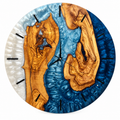 Storm Isles Olive Wood & Resin Wall Clock in slate blue and pearly white on a white background