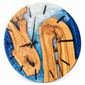 Twin Blue Isles Olive Wood & Resin Wall Clock in blue and white on a white background